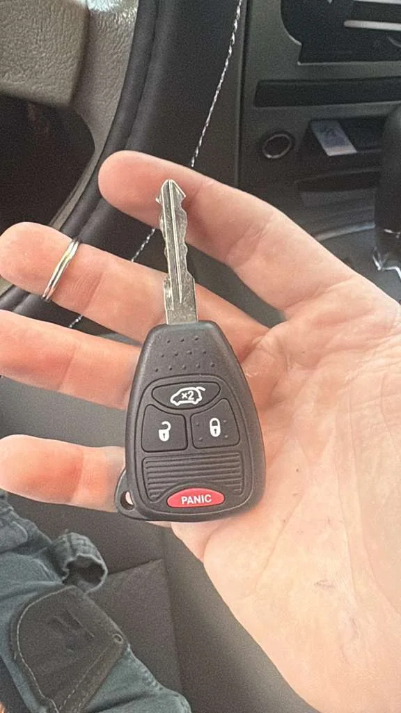 vehicle key and car prepared for replacement service, real company service photo 3